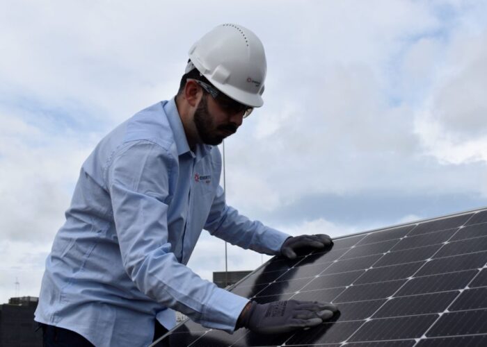 Enertis Applus+ technician working on a solar panel